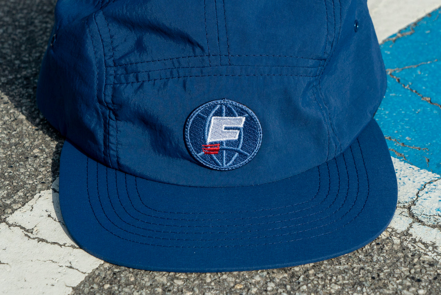 "WORLD" 5 PANEL HAT - NAVY BLUE